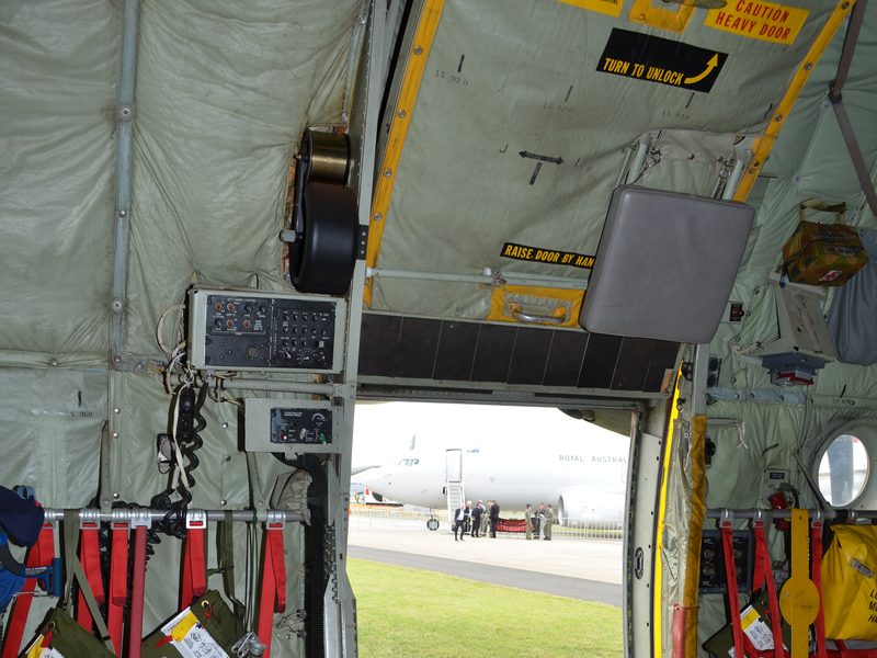 AMCE negator spring assembly above an open C-130 paratroop door
